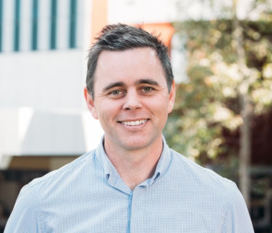 Profile image of David Trembath, a man with short dark hair, wearing a blue collared shirt.